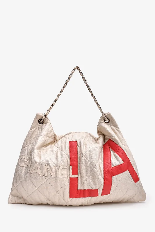 Trendy And Discounted Designer Handbags Pre-Loved Chanel™ 2008/09 Beige Metallic Cloth Quilted Jumbo LA Logo Hobo Chain Tote