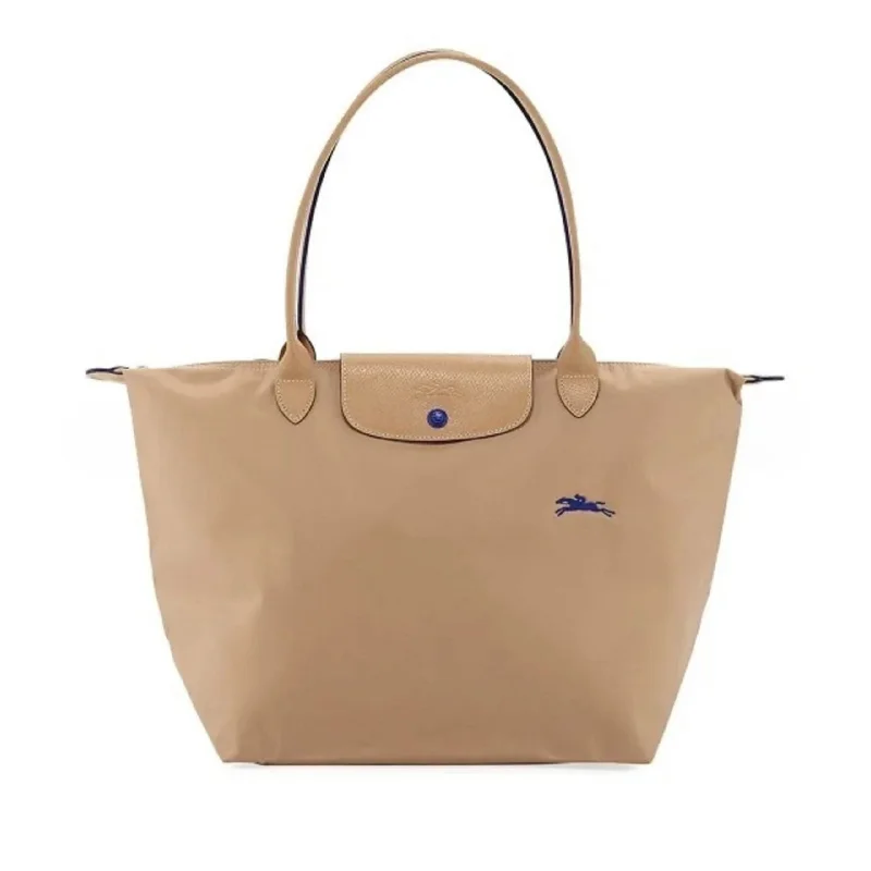 Trendy Bags For Women And Men In 2025 Longchamp La Pliage Tote Beige